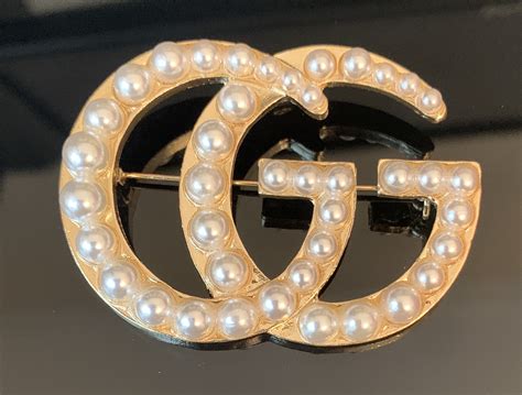 borcegos gucci|designer gucci brooches.